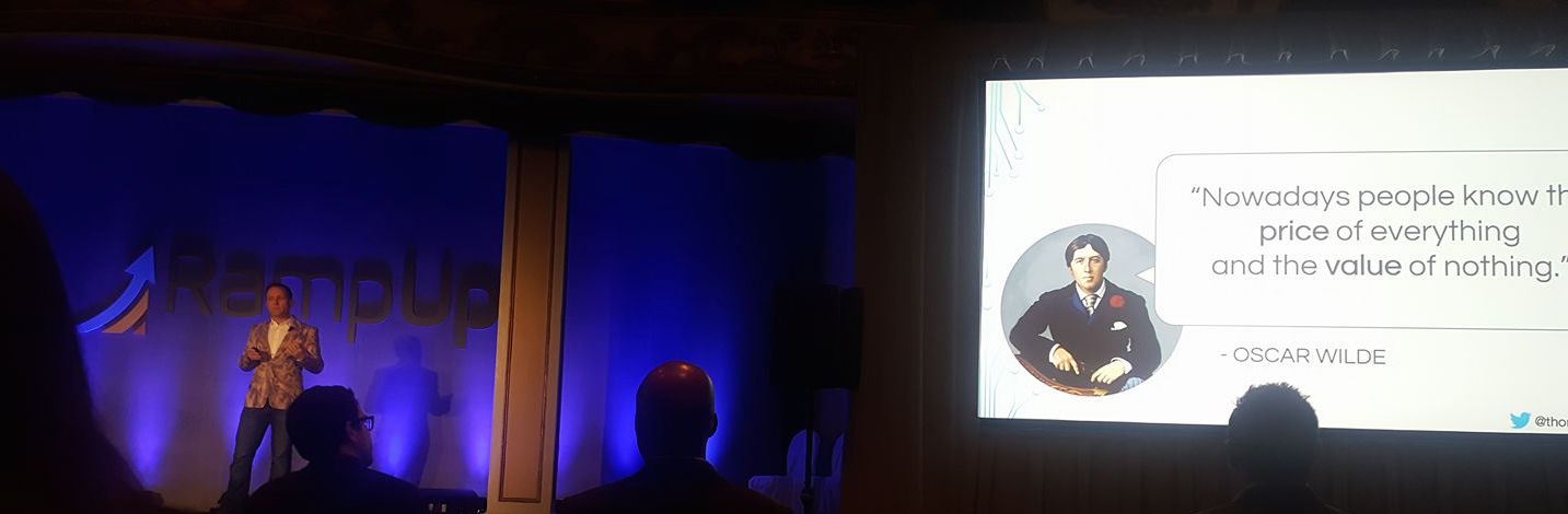 Thoryn Stephens presenting at RampUp beside a slide quoting Oscar Wilde