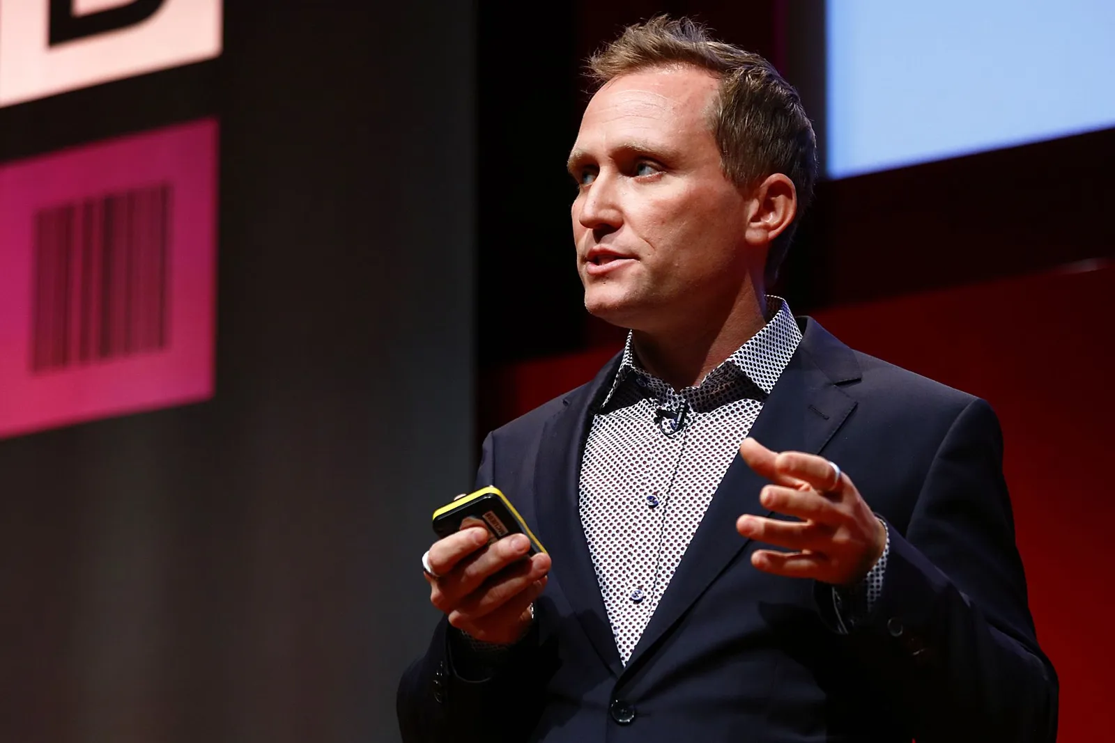 Thoryn Stephens speaking on stage at a conference